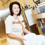 Laundry services. woman with washing machine